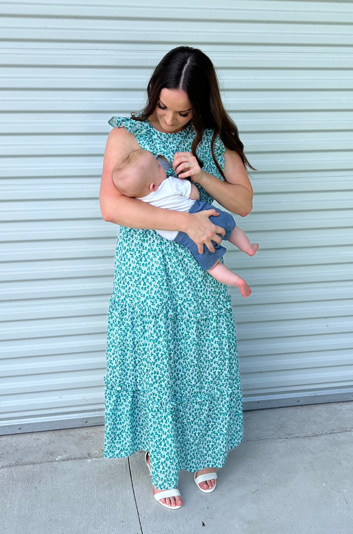 Mom and baby nursing in green floral dress